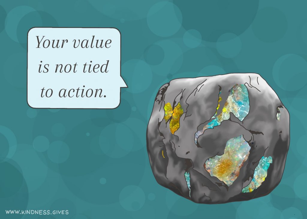 A rock with opalescent bits saying "Your value is not tied to action."